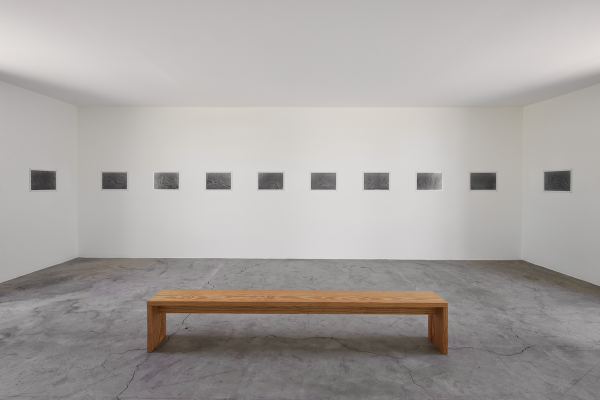 Installation view of photography show in a museum space. Zoe Leonard's Al rio/To the River series is on view at The Chinati Foundation in Marfa, Texas.