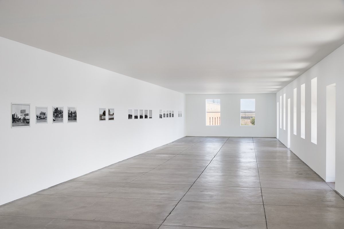 Installation view of photography show in a museum space. Zoe Leonard's Al rio/To the River series is on view at The Chinati Foundation in Marfa, Texas.