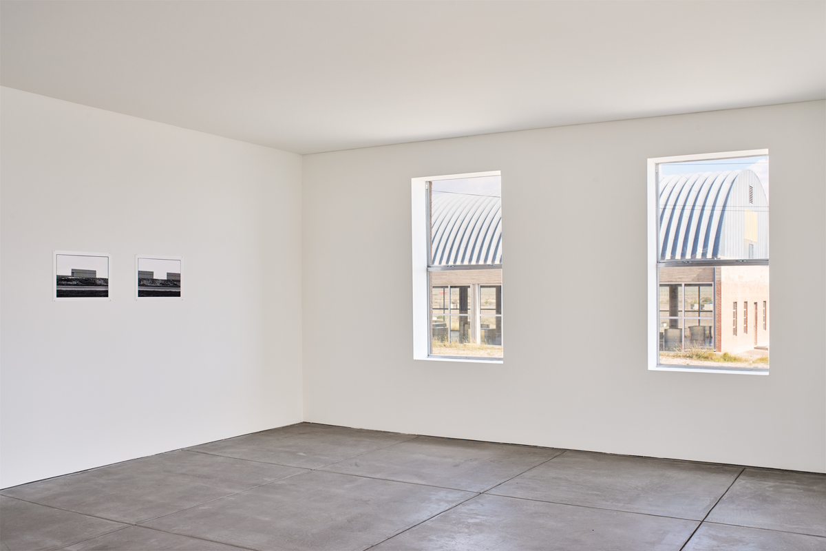 Installation view of photography show in a museum space. Zoe Leonard's Al rio/To the River series is on view at The Chinati Foundation in Marfa, Texas.