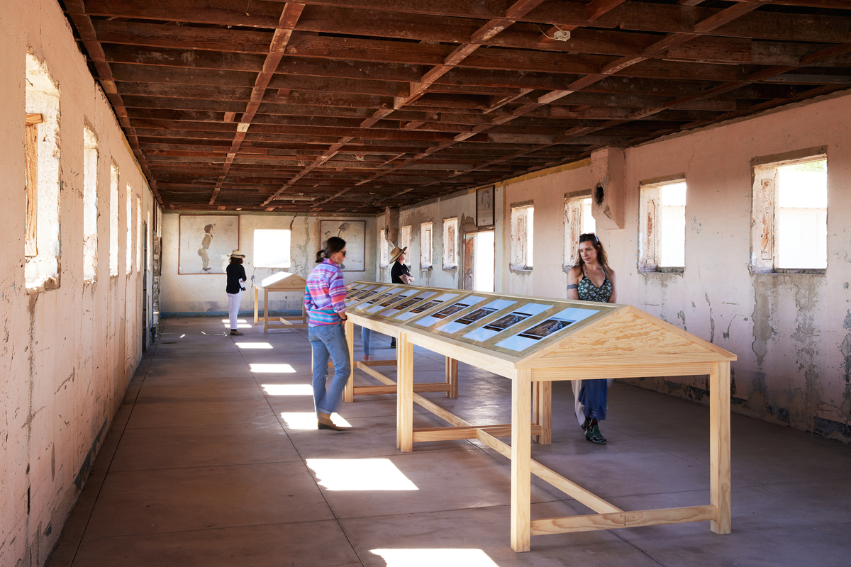 Installation view of photography show in a museum space. Zoe Leonard's Al rio/To the River series is on view at The Chinati Foundation in Marfa, Texas.