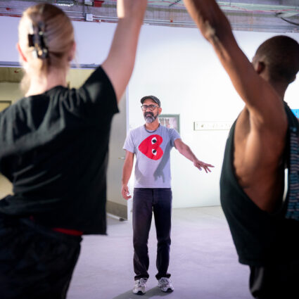 A performance artist directs his collaborators in a pristine museum space. Brendan Fernandes is one of the featured artists in Movements Toward Freedom at MCA Denver.