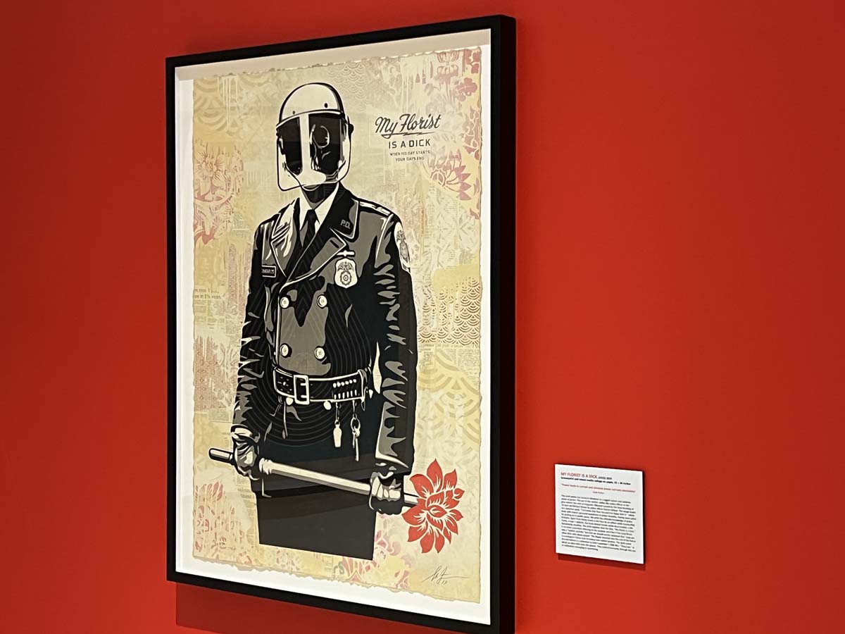 Shepard Fairey, My Florist Is a Dick, (2015) 2019, color screenprint and mixed media collage on paper, installation view at Mesa Contemporary Arts Museum. 