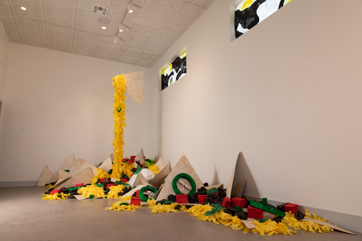 A cut-paper nacho installation in the style of a piñata by Justin Favela, on view at Nuwu Art. Curated by Fawn Douglas.