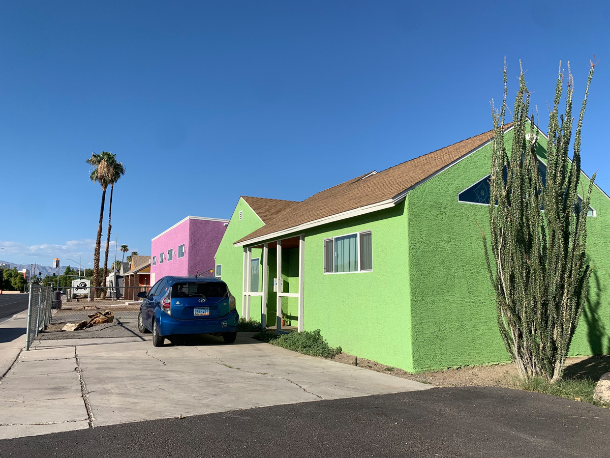 Green and pink buildings are part of the Nuwu Art campus in downtown Las Vegas.