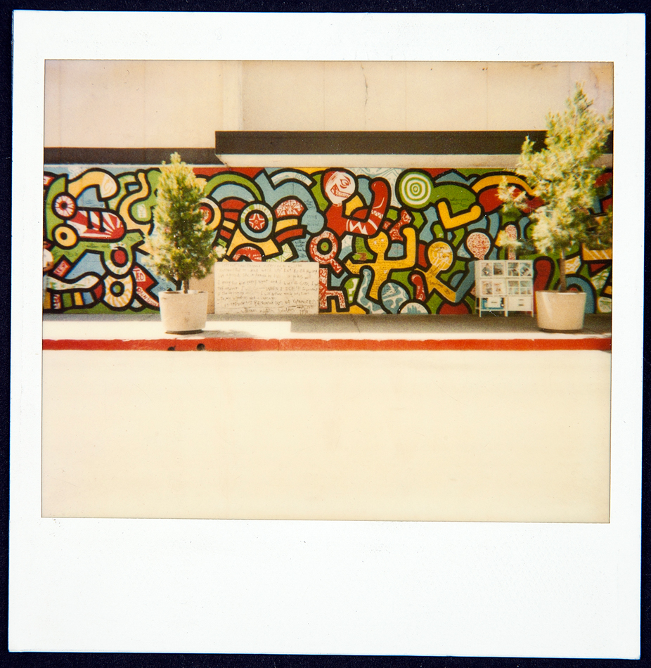 Colorful 1980s mural spearheaded by Keith Haring in Phoenix, with squiggly figures and forms characteristic of the New York Pop artist.