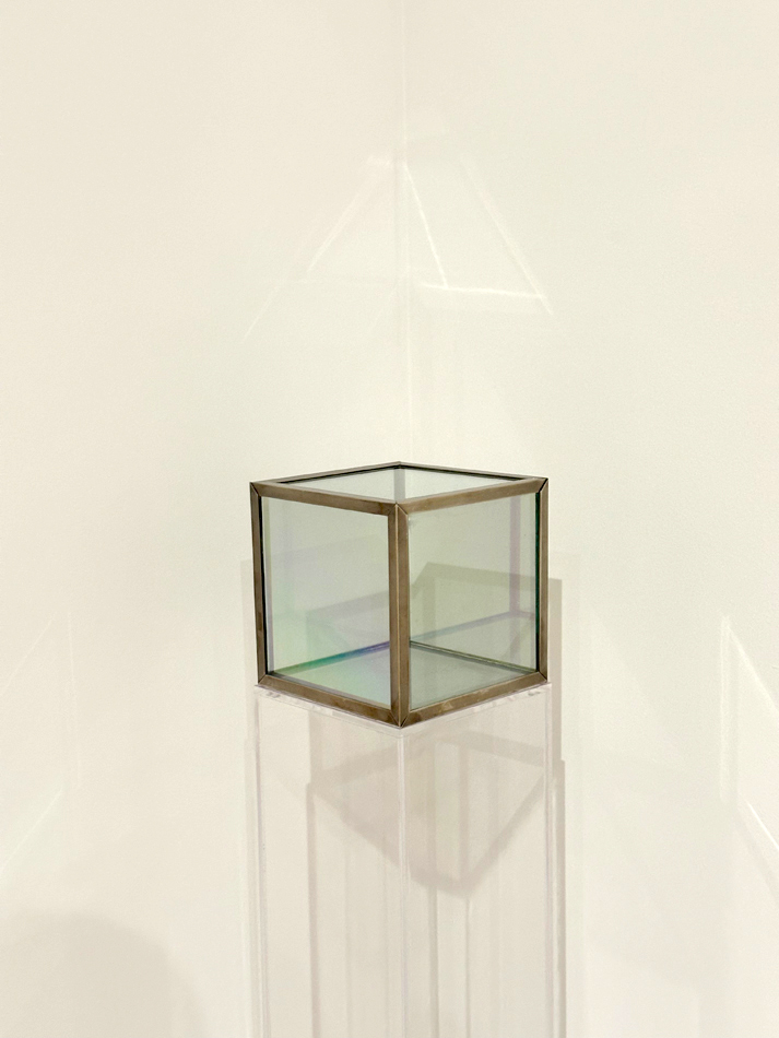 A simple glass cube, one of Larry Bell's earliest explorations of the form.