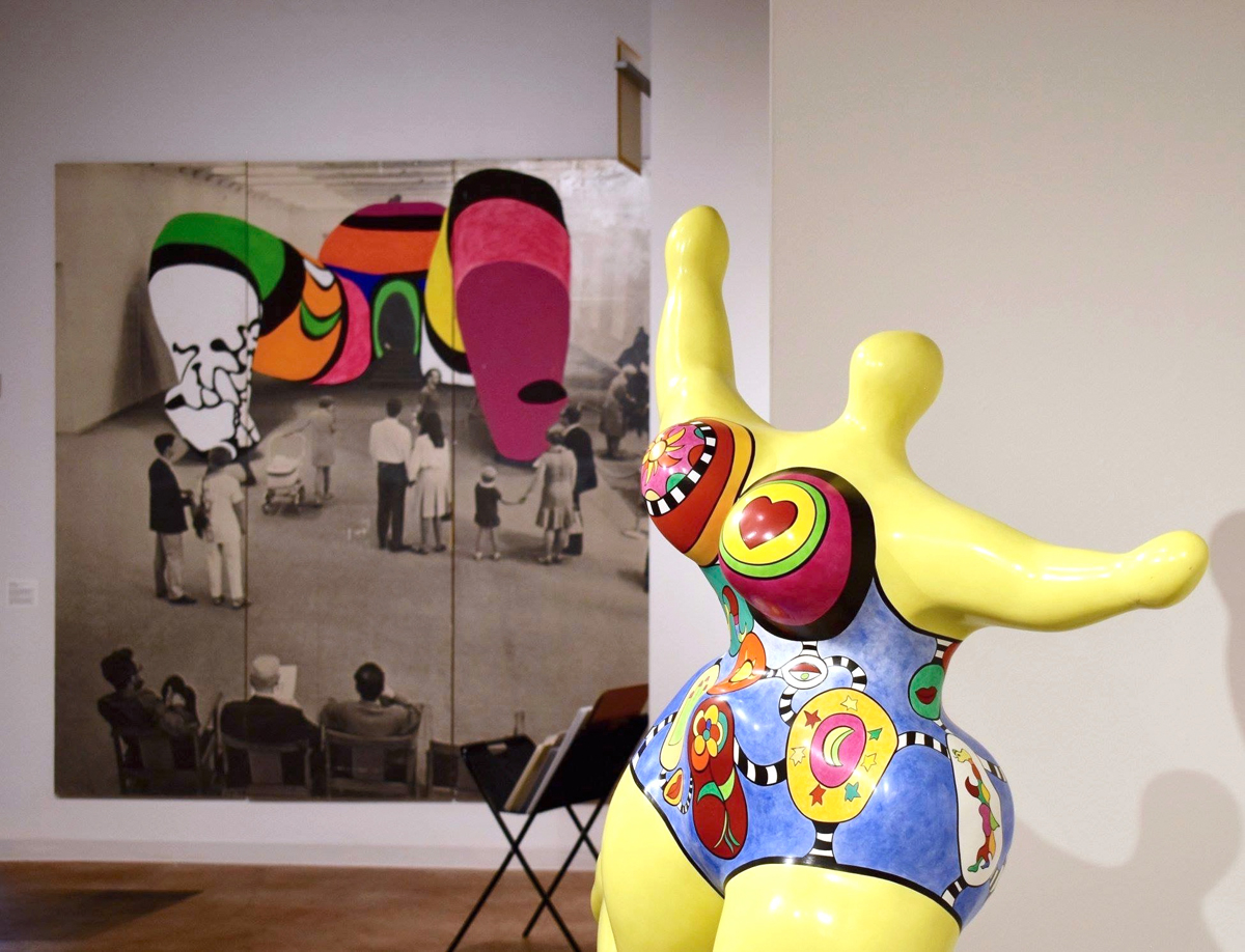 A sculpture and image of colorful, abstracted figures by Niki de Saint Phalle. The French American artist was a major influence for Utah curator Nancy Stoaks.