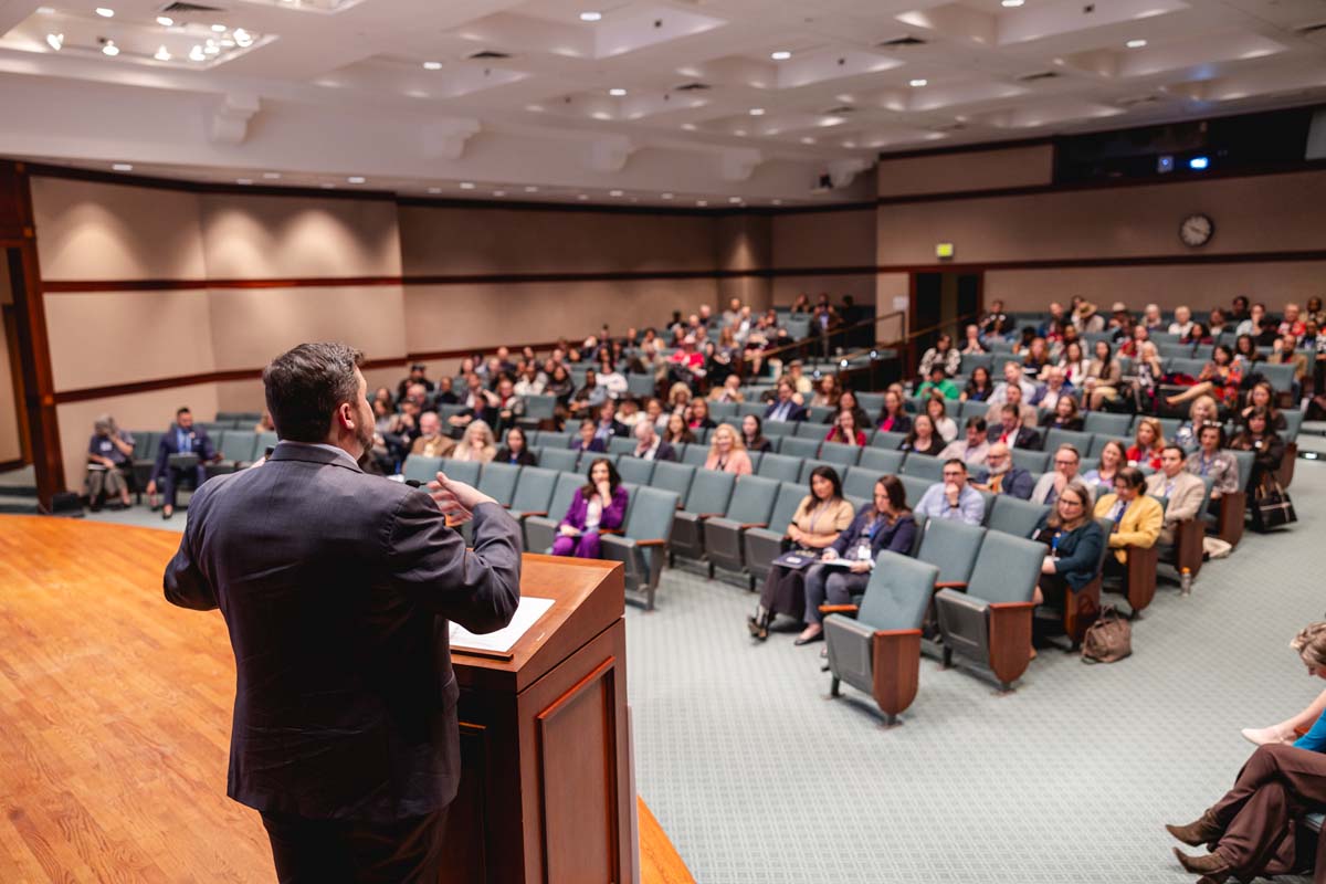 Texans for the Arts executive director Chris Kiley addresses arts advocates from across the state in the Capitol Auditorium