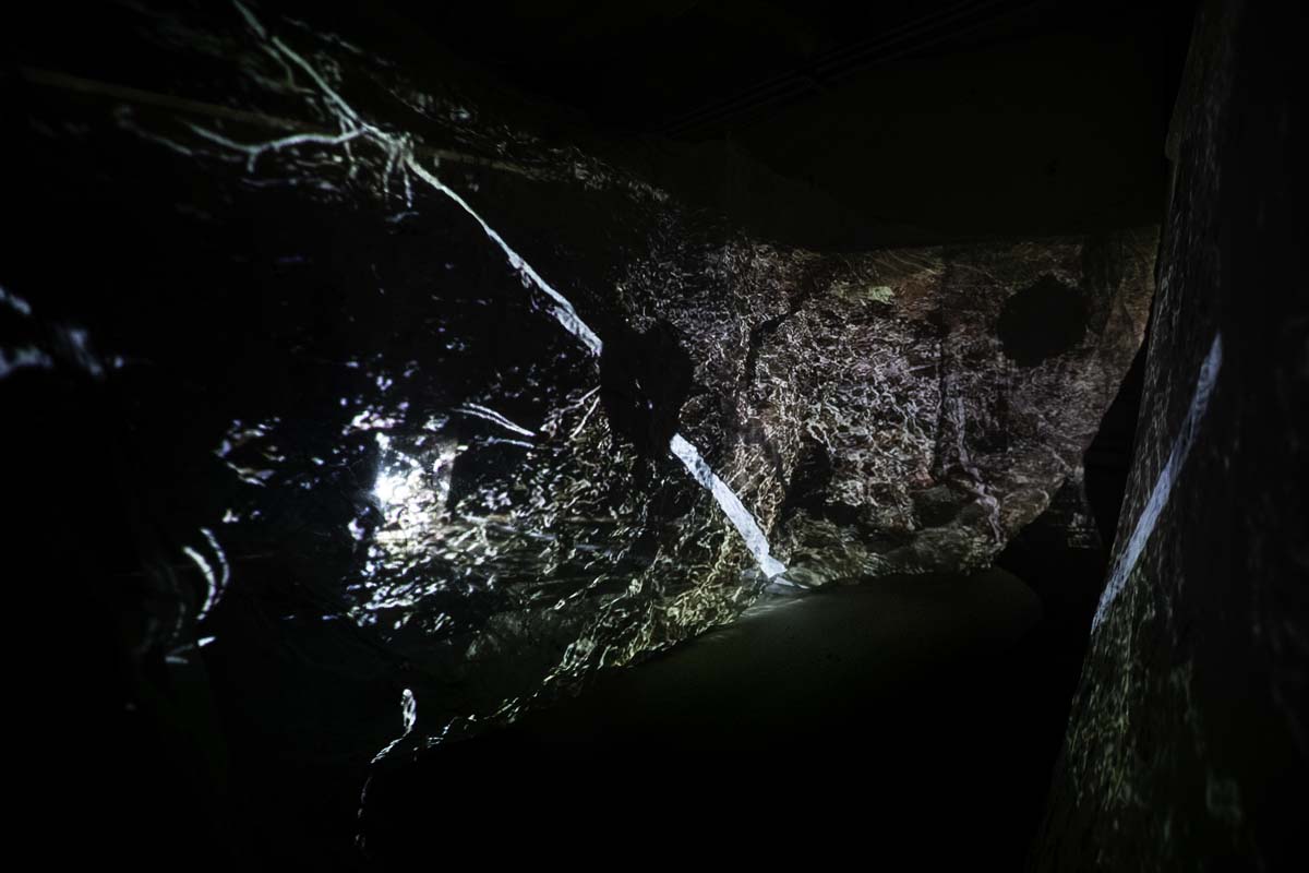 Video projection on dark water.