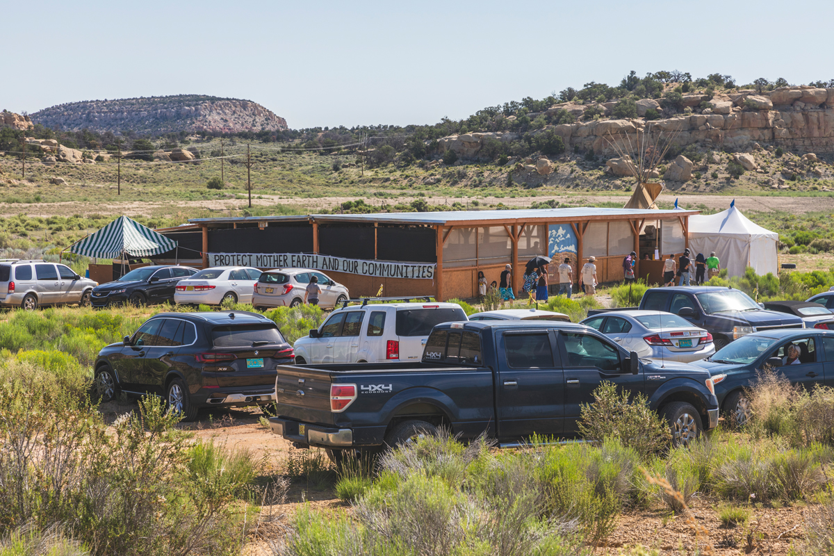 Cars outside a pavilion near the Red Water Pond Road Community.