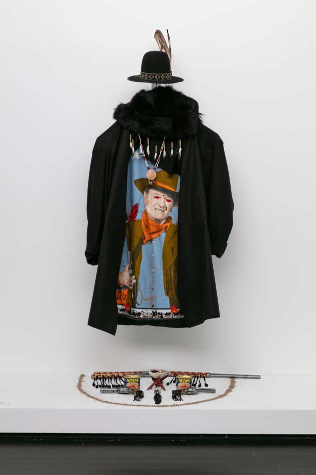 An altar-like display features objects and clothing that artist Gregg Deal (Pyramid Lake Paiute) uses while performing.