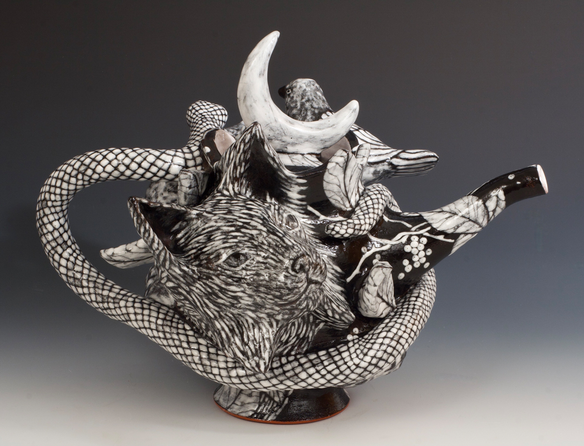 Intricate ceramic teapot artwork by Farraday Newsome depicting a bobcat and snake.
