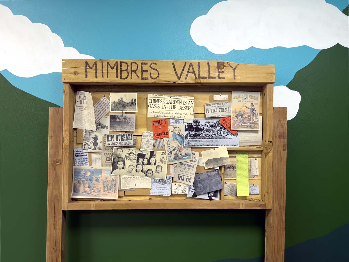 A wooden bulletin board reading MIMBRES VALLEY