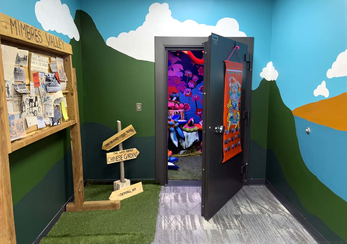 Installation view of Caroline Liu's Chinese Garden exhibition with the door slightly ajar to view into the Art Vault.