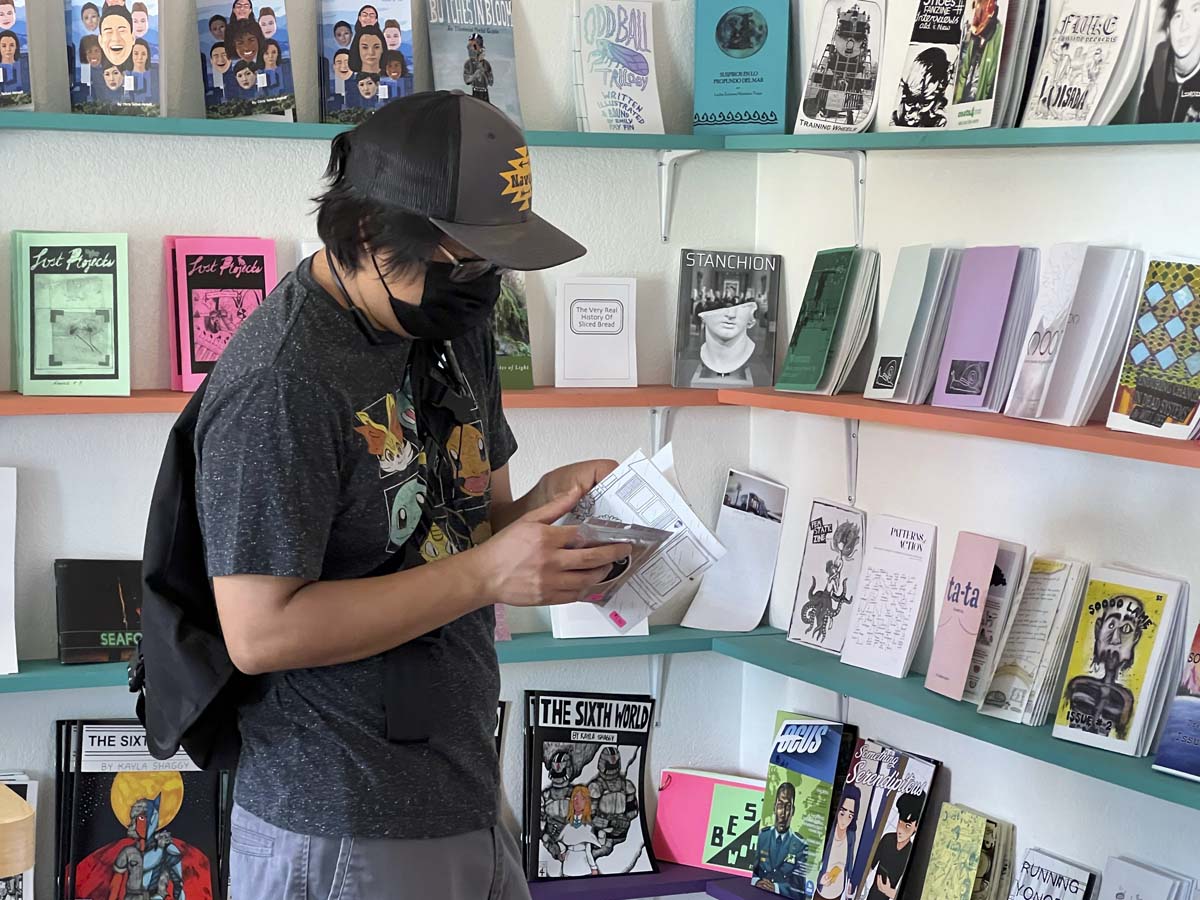 Exploring zines at Wasted Ink Zine Distro.