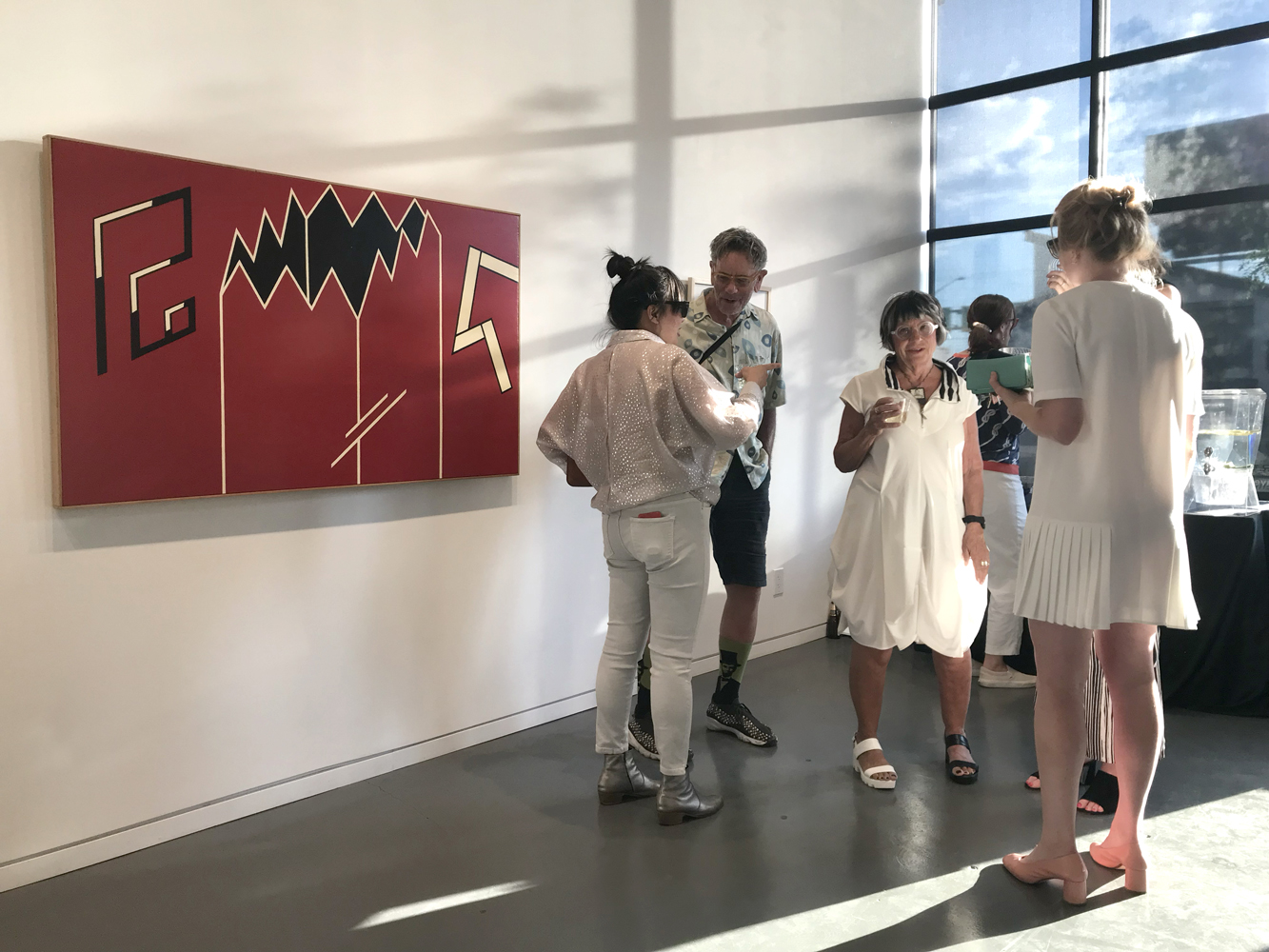 Fashionable scenesters at an art opening.