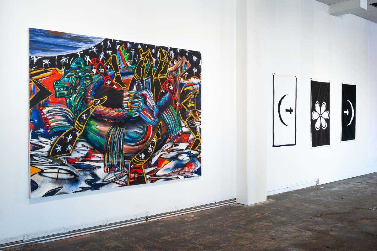 Installation view with painting by Yatika Fields and flags by Nathan Young.