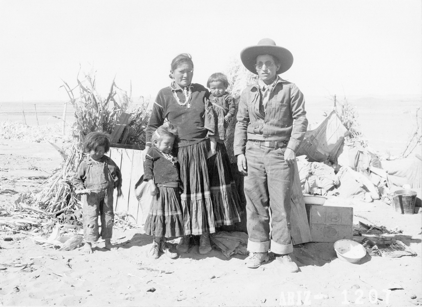 Historical photograph by Milton Snow of a Navajo family. Maxwell Museum of Anthropology in Albuquerque is working with the Navajo Nation Museum to fill in the gaps outside the frame.