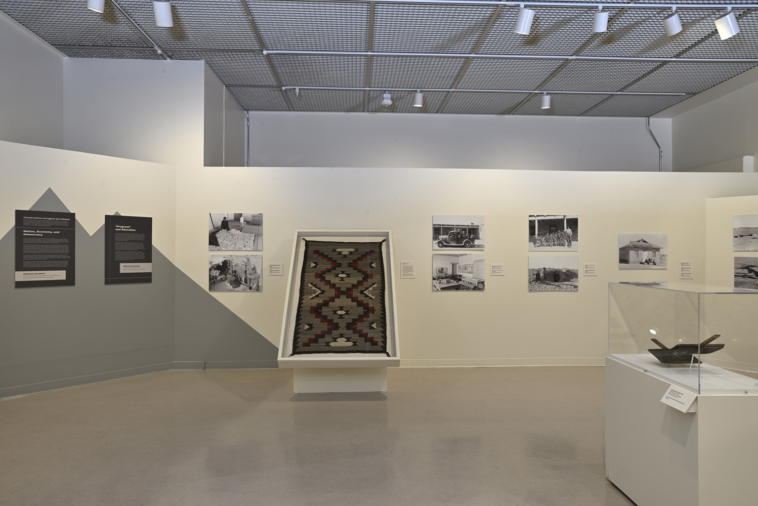 Installation view of a photography exhibition at an anthropology museum.