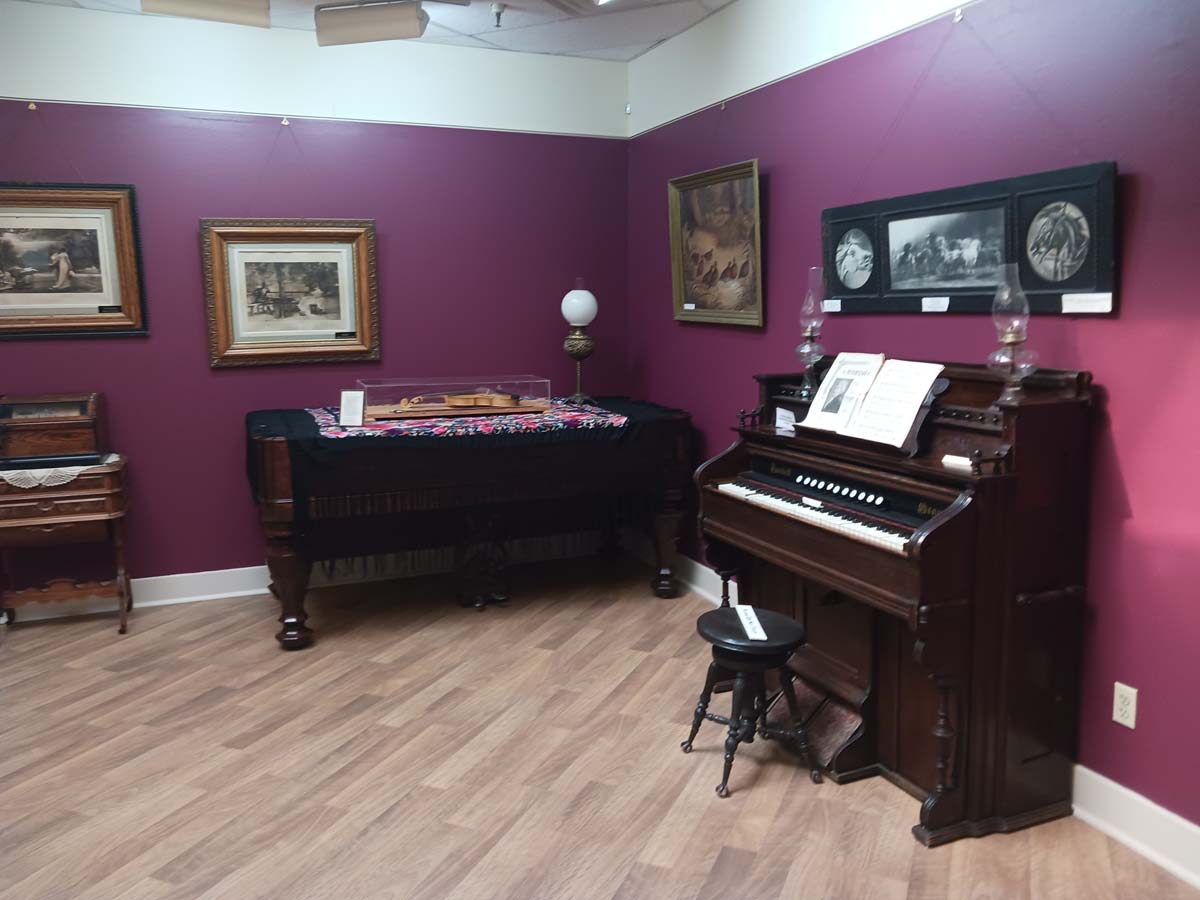 Inside the museum, with a piano on view