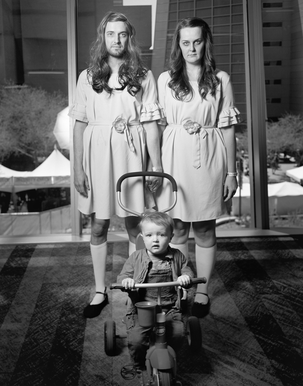 Comic Fest cosplayers dressed up like the twins in Stephen King's The Shining.