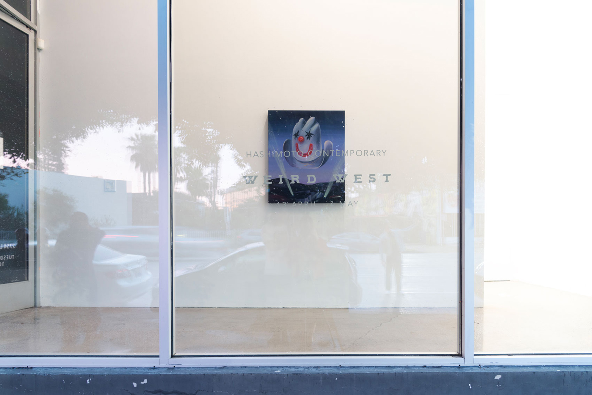 Installation view of a Los Angeles group exhibition, with a painting by Grace Kennison in the front window.