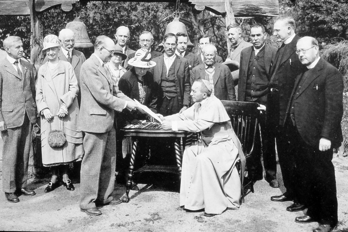 Historical photograph of the deed transfer for Santuario de Chimayo.