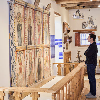 A visitor exploring the Spanish Colonial Arts Society headquarters.