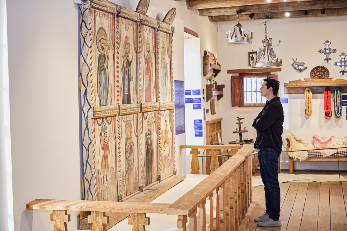 A visitor exploring the Spanish Colonial Arts Society headquarters.