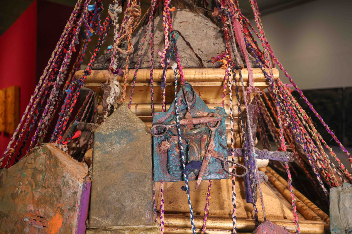 Closeup of a mixed media artwork by Michael Tracy, dense with abstract and religious imagery.