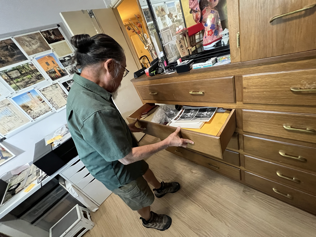 Dean Terasaki opens a drawer filled with historical ephemera in his Phoenix studio.