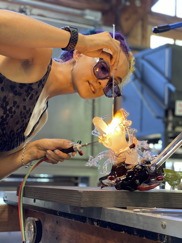 An artist works in her studio at Center for the Arts Evergreen, just one of the Southwest Artist Residencies with Summer 2025 submission deadlines.