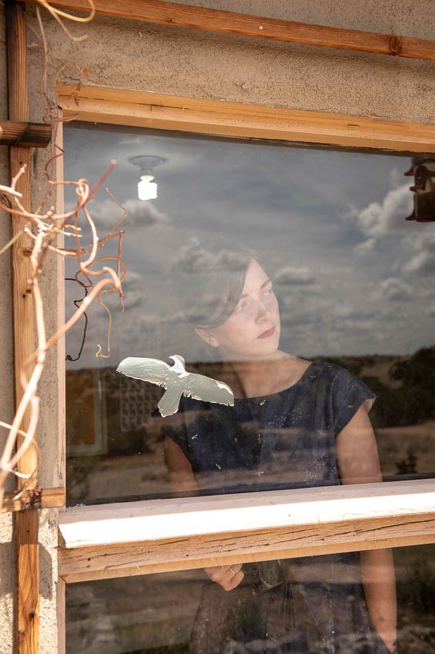 Kat Kinnick looking out her studio window.