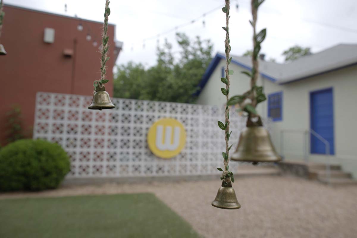 Detail of bells hanging on the Wishing Tree in the courtyard of Women and Their Work in Austin