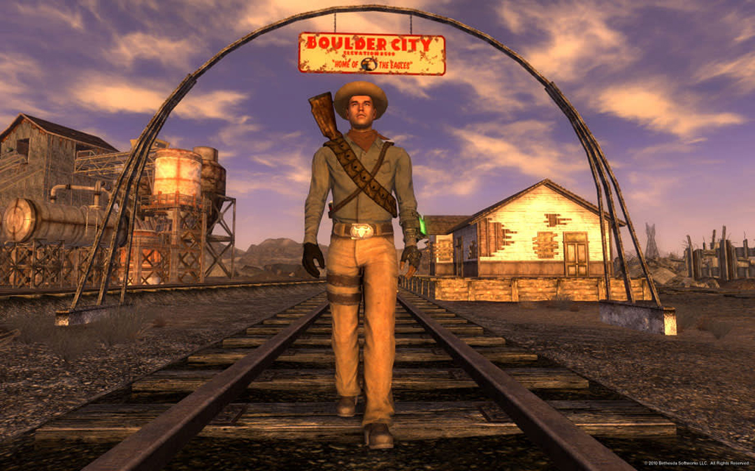 A cowboy strolls under the sign for Boulder City in Fallout New Vegas. Southwest video games rival traditional landscape art in their depictions of the region.
