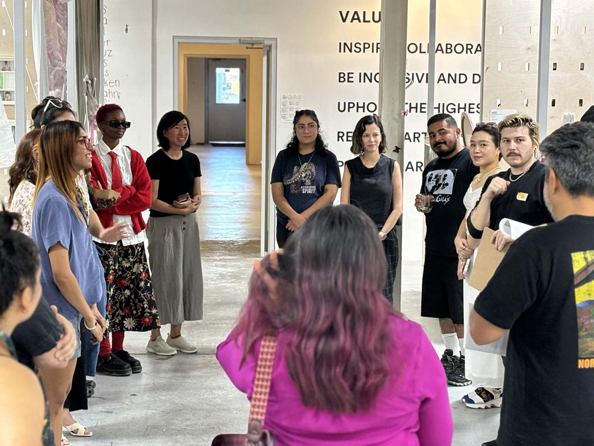 Cohort IV artists and jurors in the studio hall at the Cedars Union.