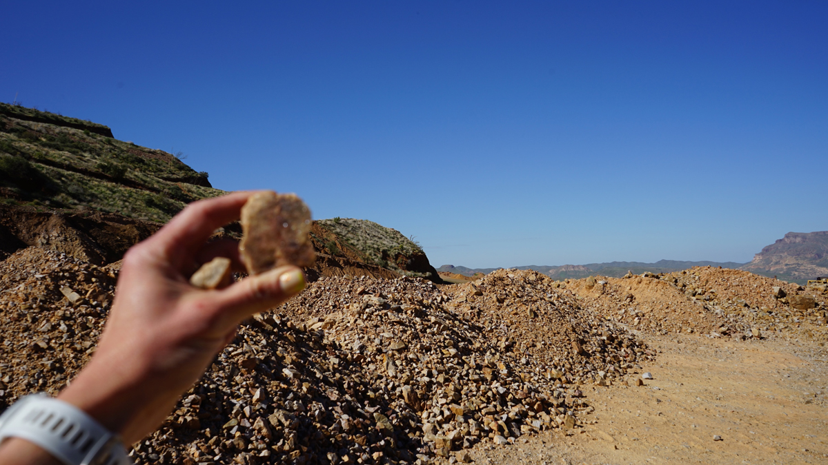 Erika Lynne Hanson holds a rock aloft on an artistic field trip.