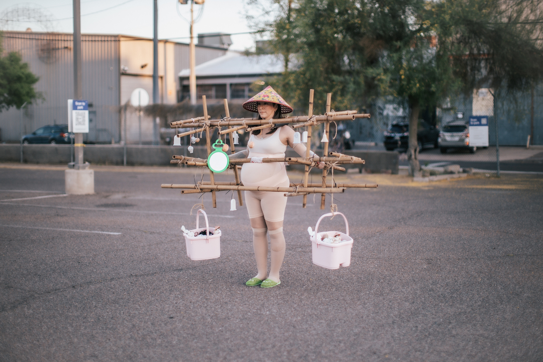 Artist Jennifer Ling Datchuk performs within a bamboo exoskeleton draped in mixed-media elements.