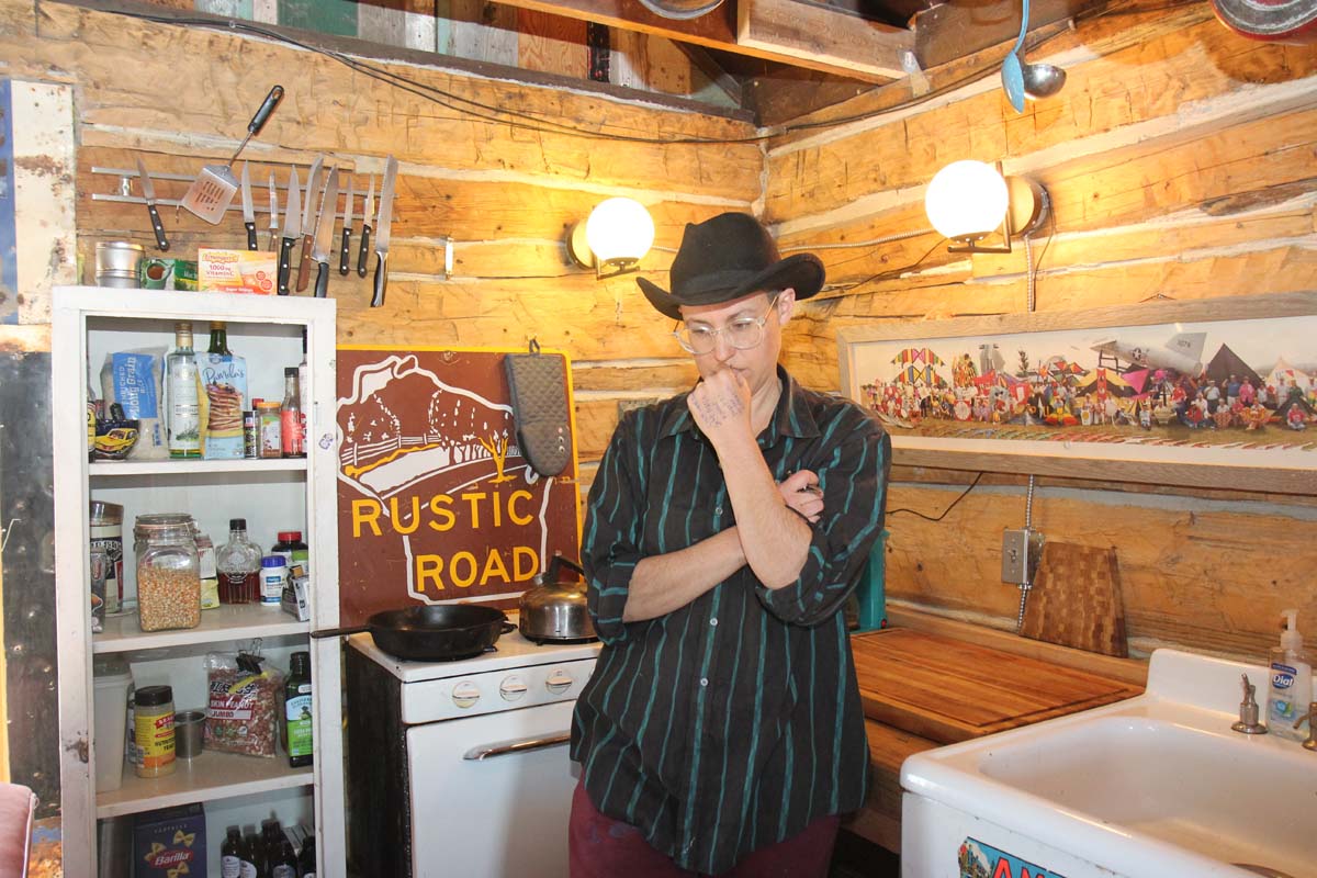 Muza inside the restored log cabin