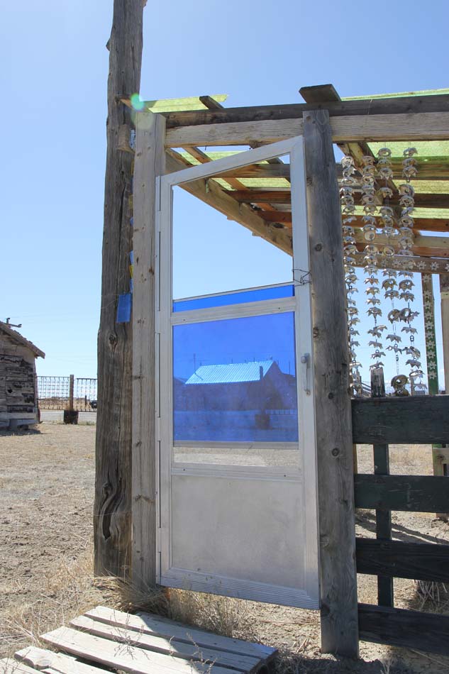 Structure made of repurposed wood and glass.