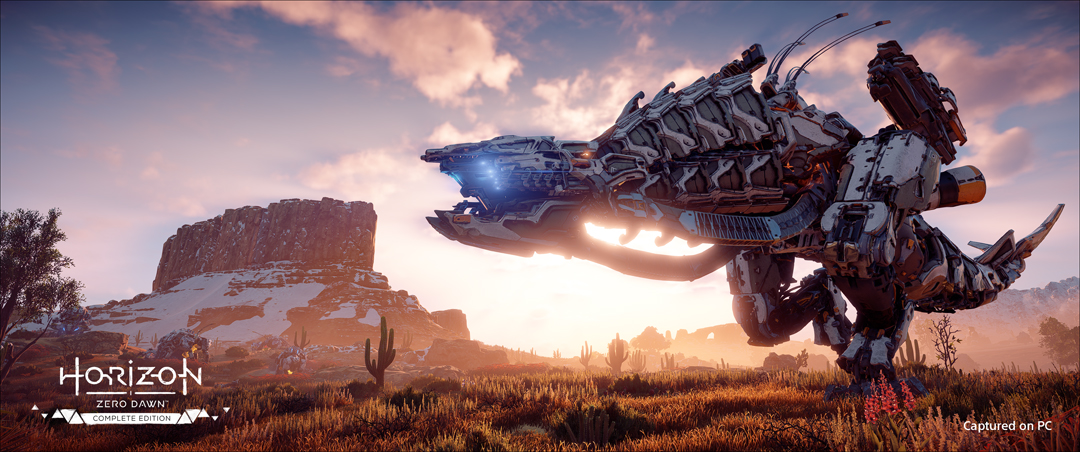A Machine lumbers near a monolithic rock form inspired by the American Southwest in Horizon Zero Dawn.