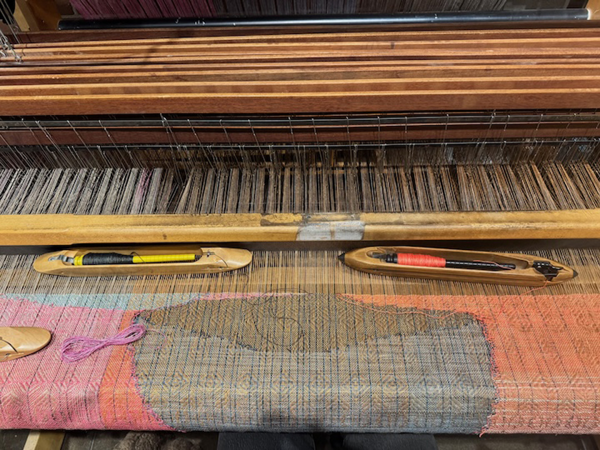 Erika Lynne Hanson's loom, with an in-progress weaving referencing the landscape through abstraction.