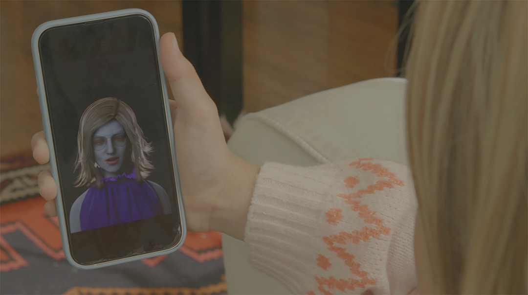 A digital persona hacks into girl's phone in a video by Lynn Hershman Leeson.