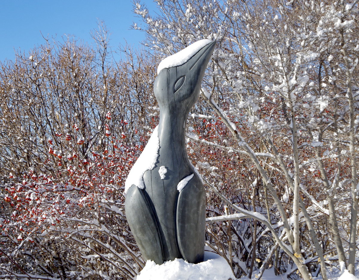 A bird sculpture covered in snow, in Salt Lake City, Utah. Guide to contemporary art in Southwest Botanical Gardens.