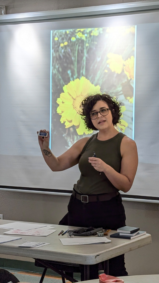 An artist teaches at drawing class at a Southwest botanical garden.