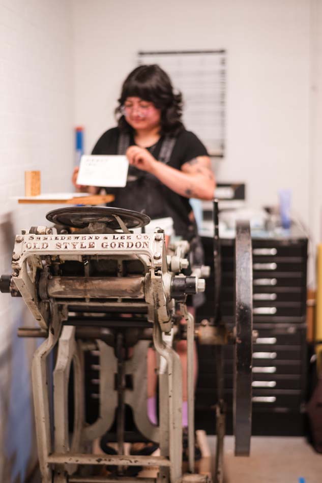 Working with the printing presses at the CU.