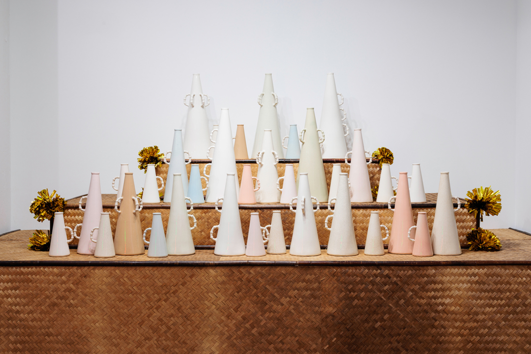Installation of porcelain cheer megaphones by Jennifer Ling Datchuk, at the Bemis Center for Contemporary Arts in Omaha, Nebraska.