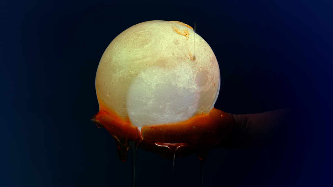 Still from a new media artwork by Virginia L. Montgomery showing a hand cradling a glowing moon.