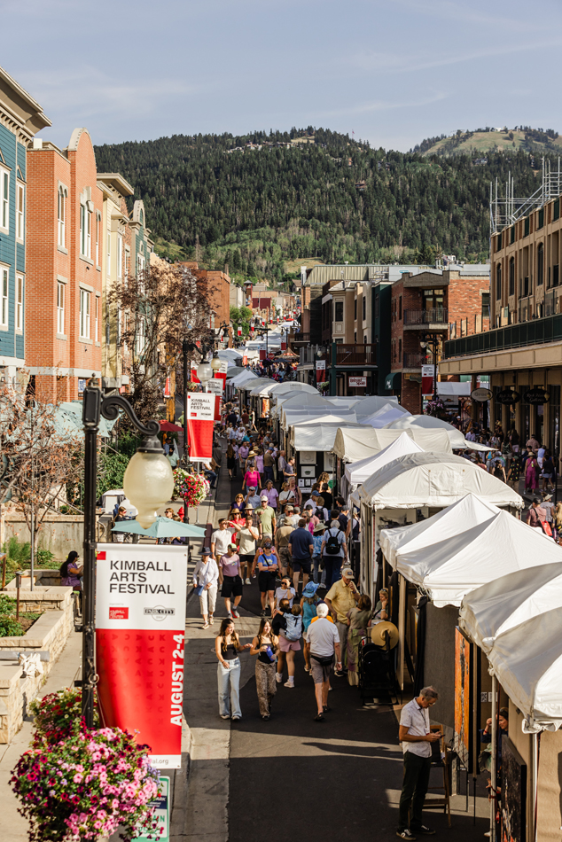 Bustling Park City street during the Kimball Arts Festival, part of the essential Park City Art Guide.