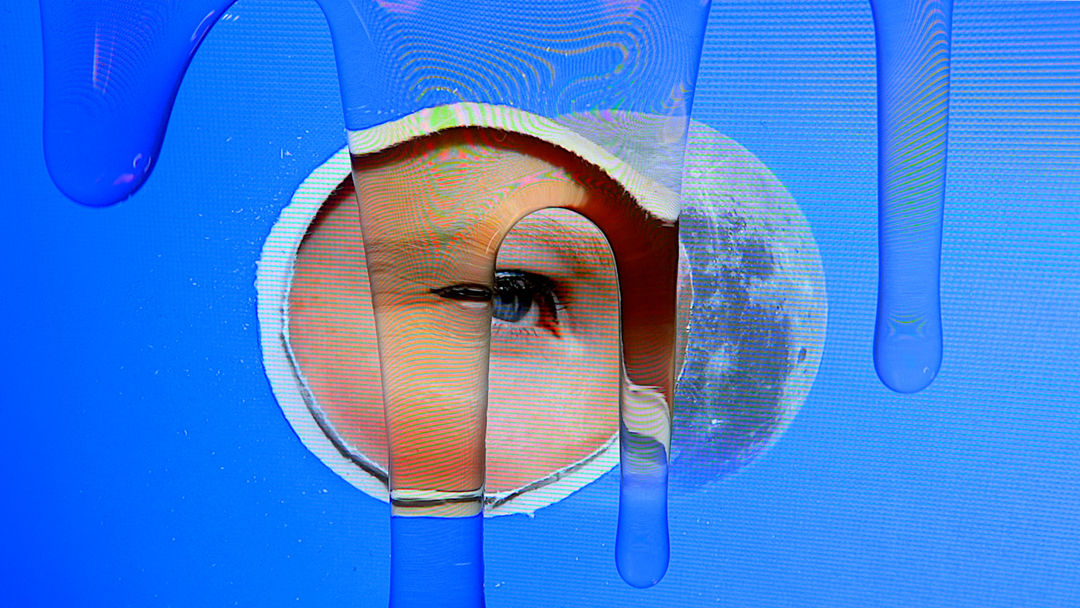 Still from a digital video showing an eye, a moon, and dripping honey.